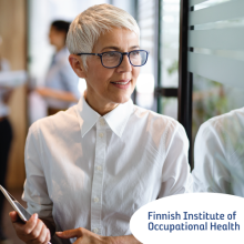 Confident stylish european mature business woman standing at workplace.