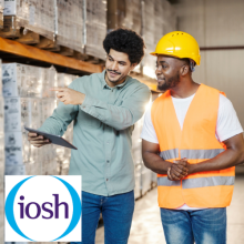 IOSH logo and young diverse storage manager with tablet talking to his migrant black worker at warehouse