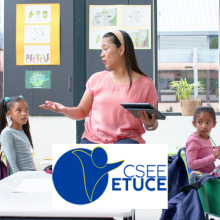 In school, teacher holding tablet and talking to students in classroom 