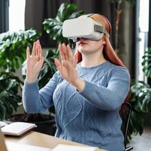 Woman at work using a VR headset