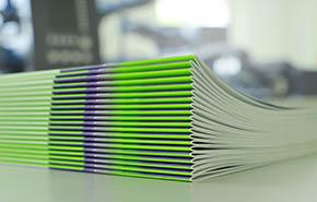 Stitched printing brochures folder in the bookbindery or print shop.